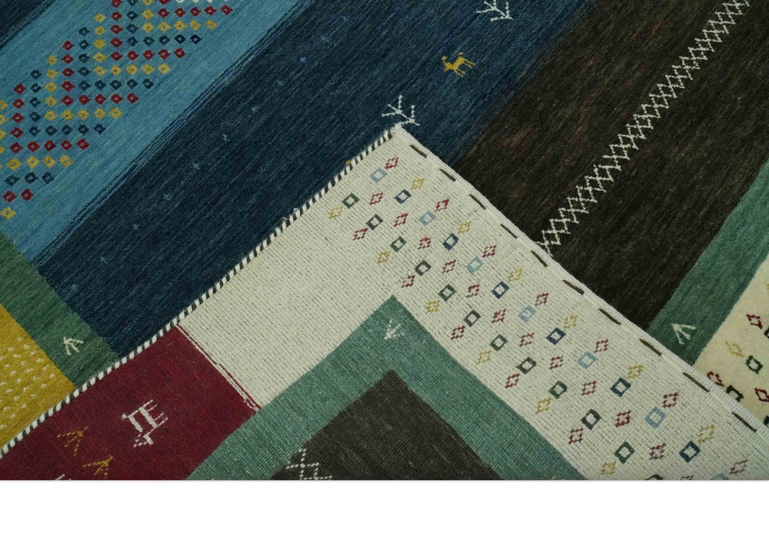 Tribal Gabbeh Blue, Gold, Maroon and Ivory Stripes design Traditional Hand loom 4.6x7 Wool Area Rug - The Rug Decor