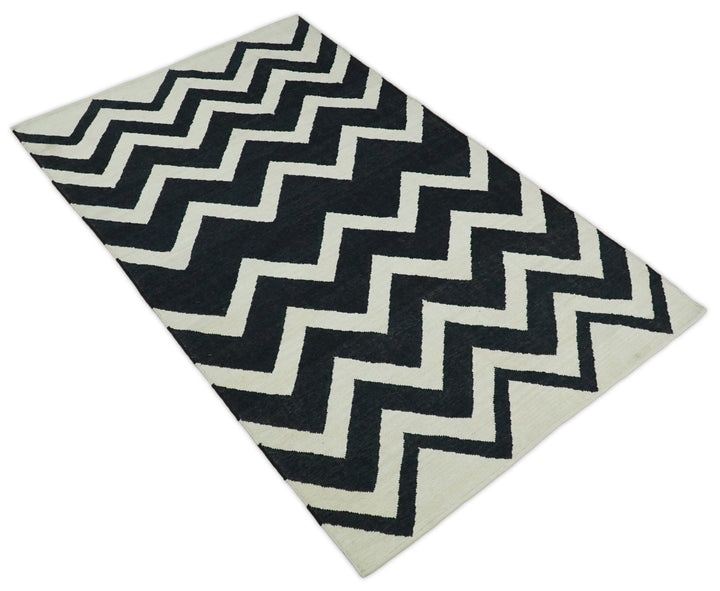 Black and Beige Outdoor Safe Hand Woven Dhurrie Rug Chevron Pattern - The Rug Decor