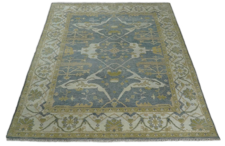 Hand-knotted Oushak wool rug in gray and beige with an ornate floral field and border