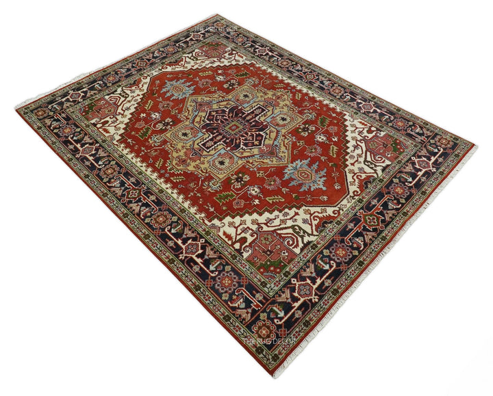 Red and blue Serapi rug shown at an angle with a central medallion and ornate border
