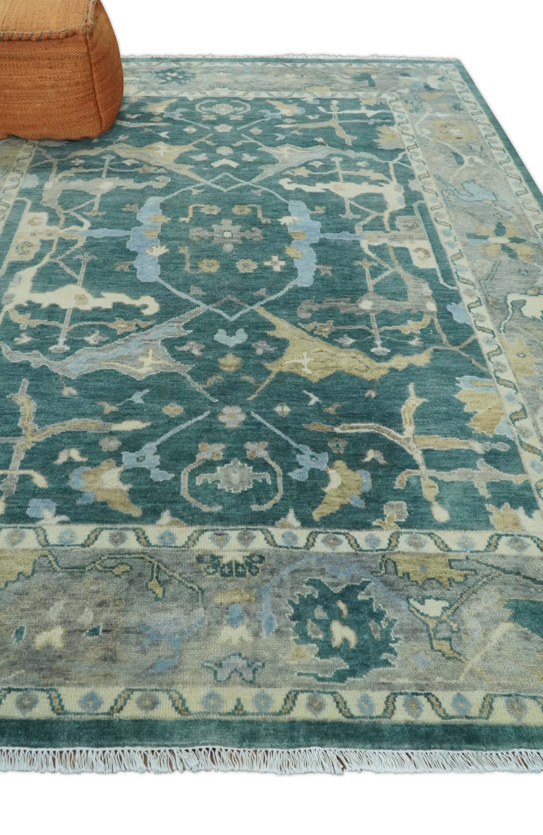 Teal and beige hand-knotted wool Oushak rug with distressed geometric medallion pattern.