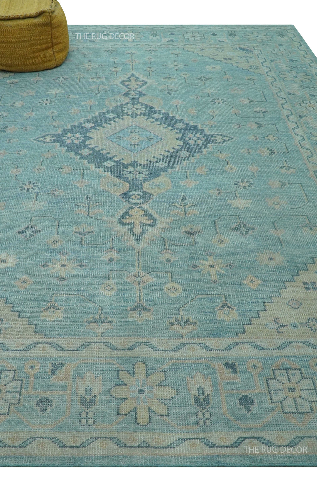 Hand-knotted wool area rug with blue field and beige central medallion with border