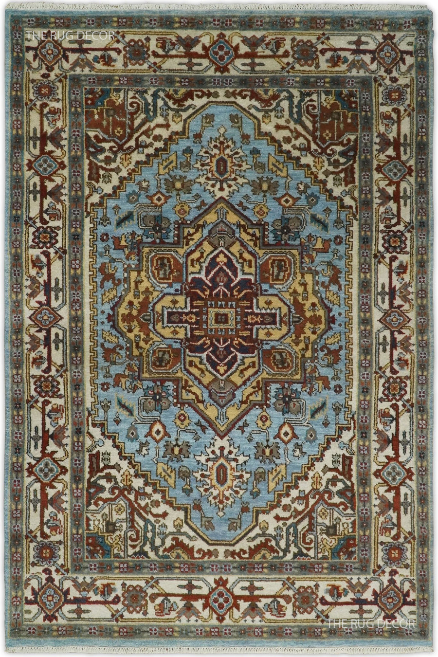 Sera hand-knotted wool rug with a blue field, ivory border, and ornate central medallion