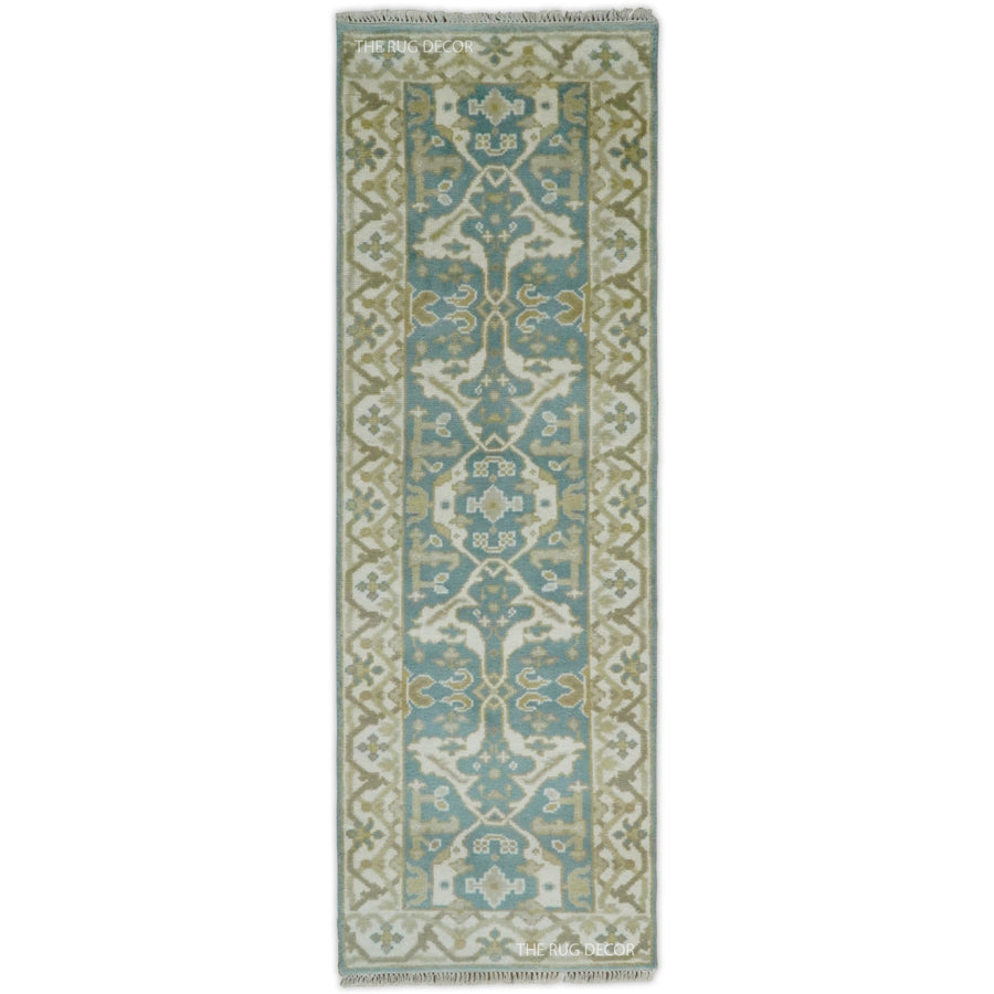 Hand-knotted teal and ivory wool Oushak runner rug with an ornate central pattern