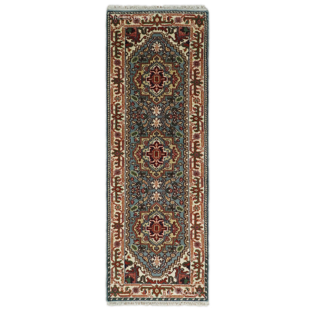 Blue and ivory wool runner rug with traditional medallion and floral patterns