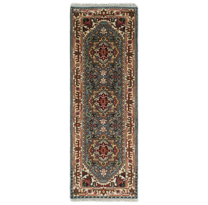 Blue and ivory wool runner rug with traditional medallion and floral patterns