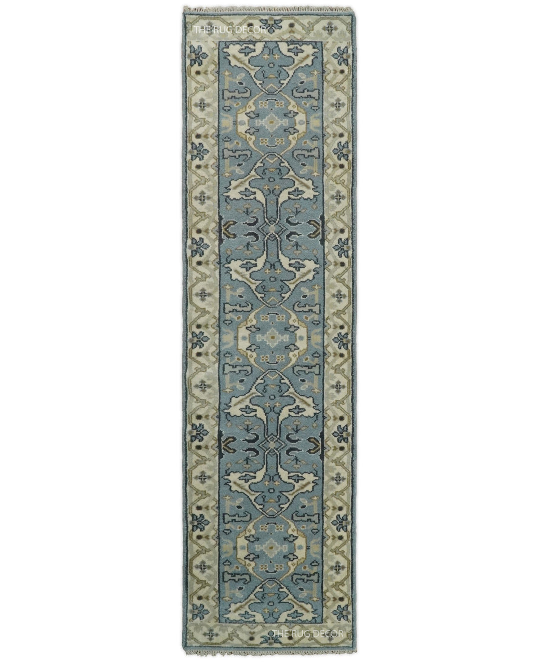 Hand-knotted wool runner rug with blue-gray floral motifs and beige borders