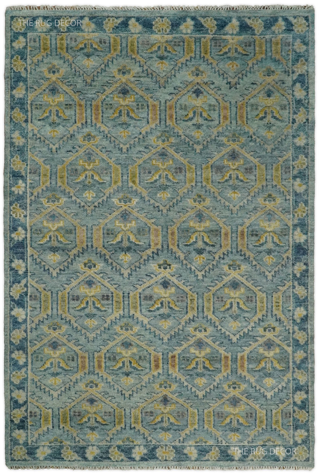 Traditional hand-knotted wool rug in antique blue and mustard with geometric motifs