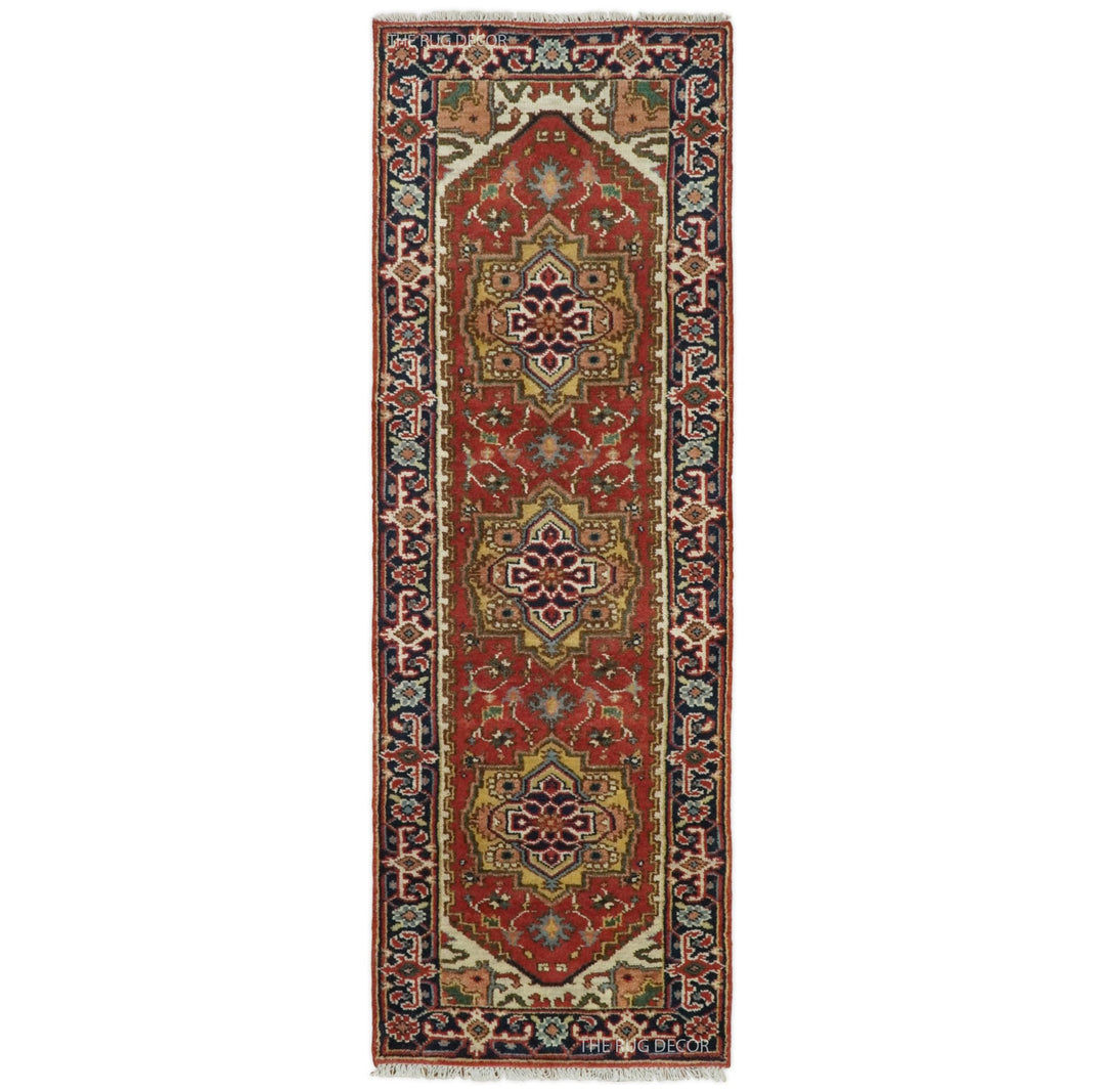 Traditional Serapi wool runner rug in rust and blue with three central medallions and ornate borders