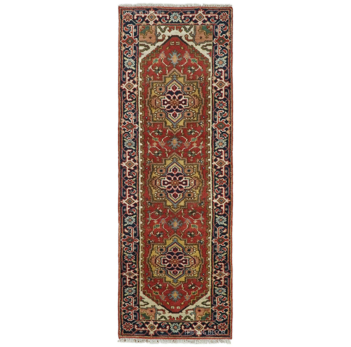 Traditional Serapi wool runner rug in rust and blue with three central medallions and ornate borders