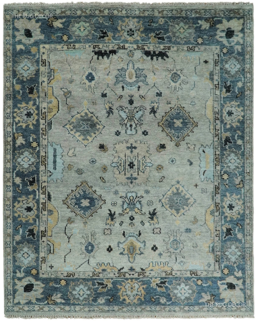 Silver and blue traditional oriental hand-knotted wool area rug with ornate medallion pattern