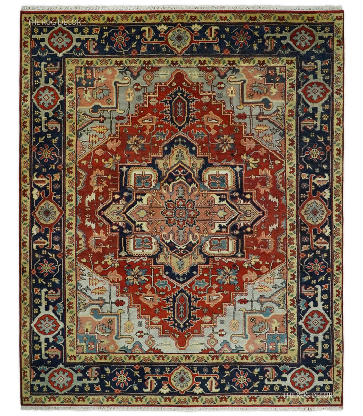 Red and blue traditional medallion hand-knotted wool rug with ornate border, cream center
