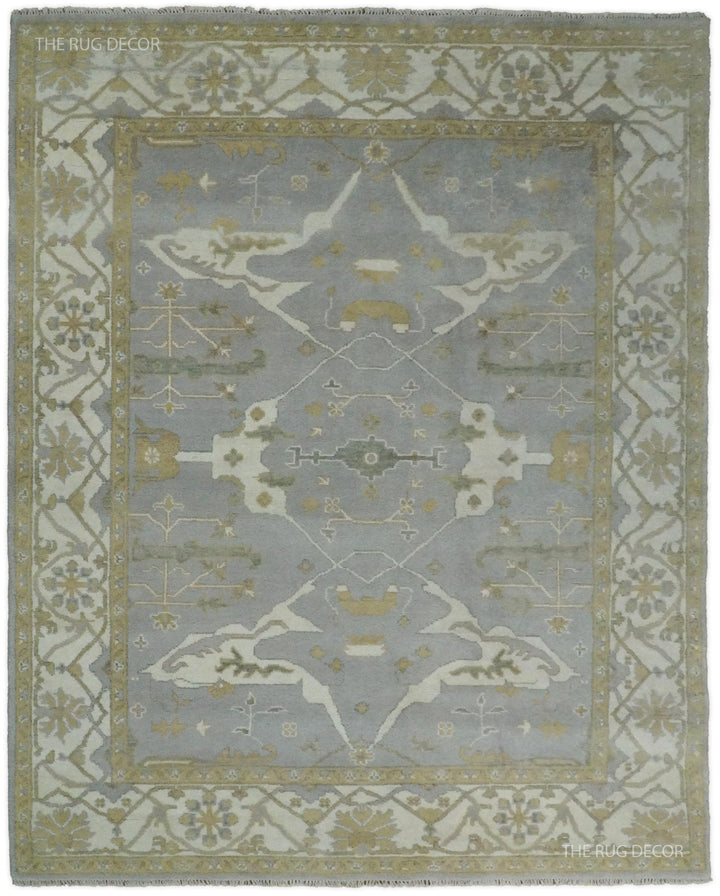 Gray and ivory hand-knotted wool Oushak rug with ornate central medallion and floral border
