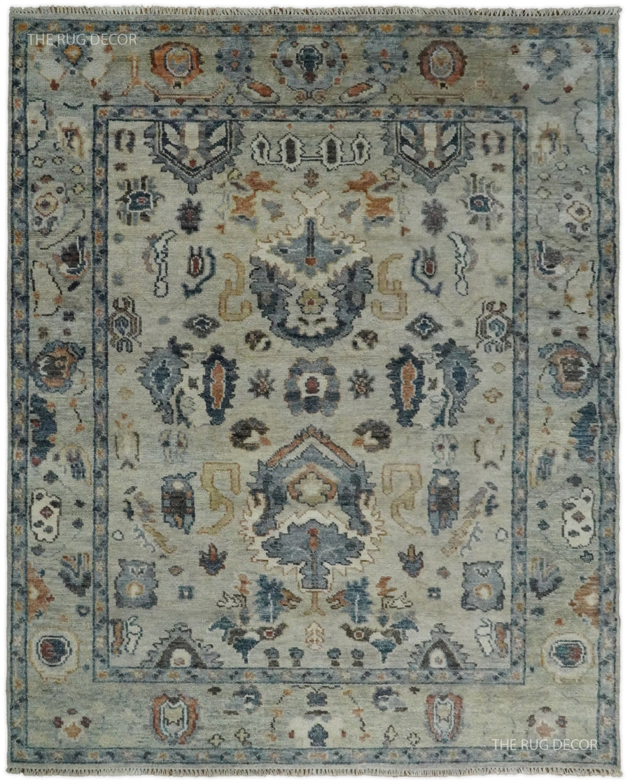 Beige and blue hand-knotted wool rug with an ornate traditional medallion and border