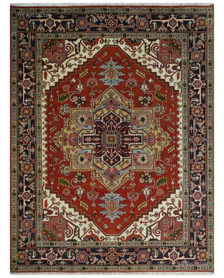 Red and blue hand-knotted Serapi rug with an ornate central medallion and patterned border