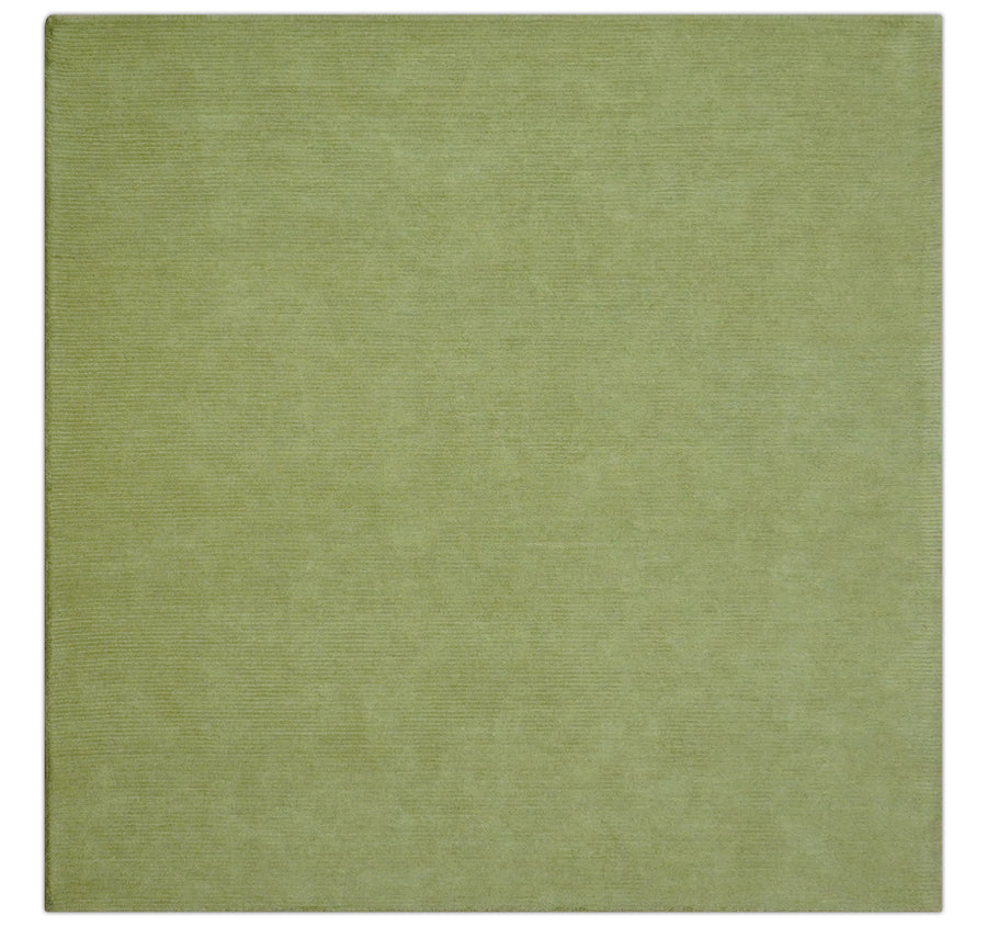 Green hand-tufted wool rug with solid modern square design