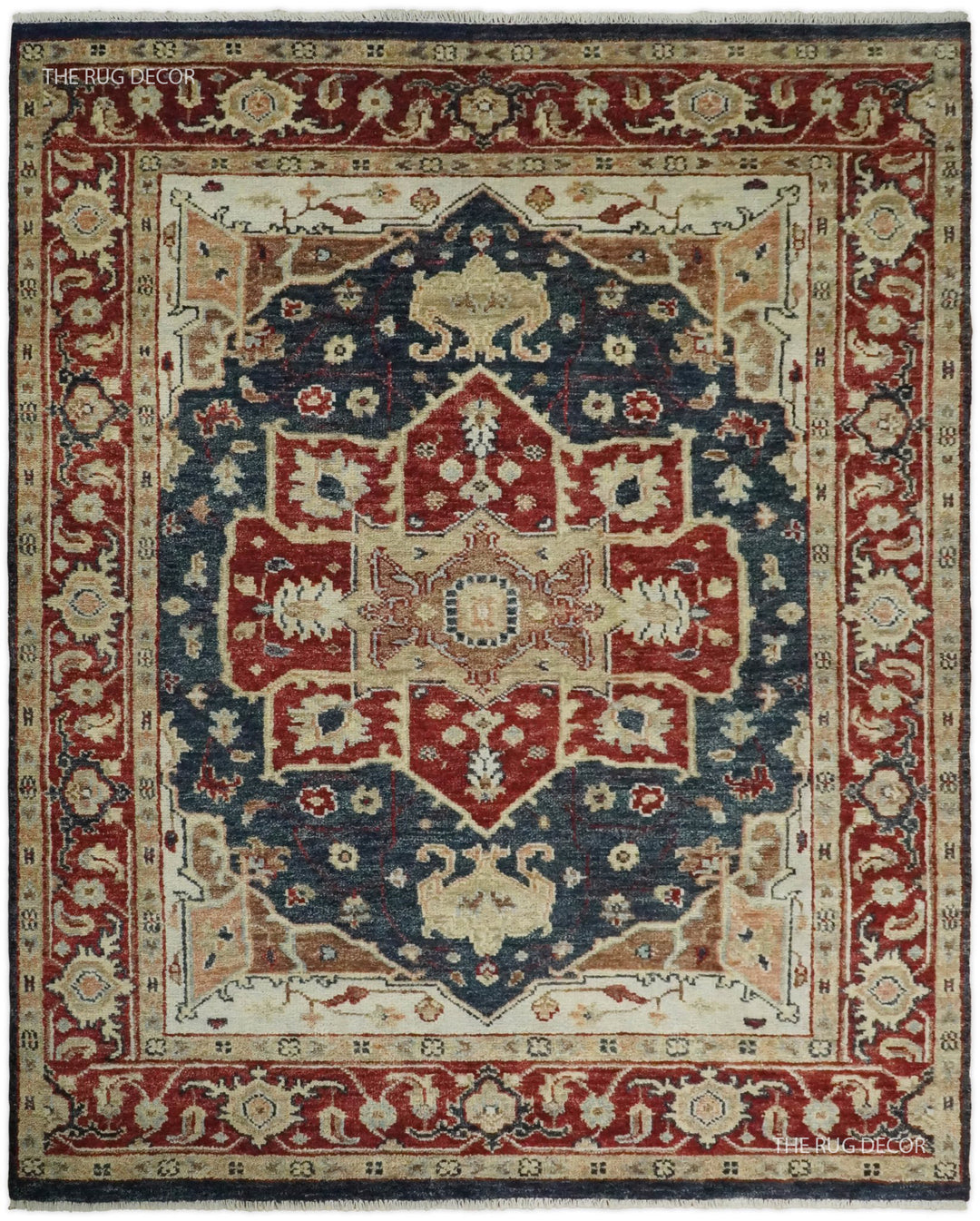 Red and blue hand-knotted wool rug with a traditional Serapi medallion and ornate border