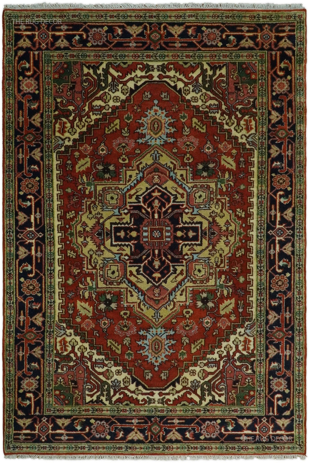 Traditional medallion rug with rust red center, dark blue border, and ornate geometric motifs