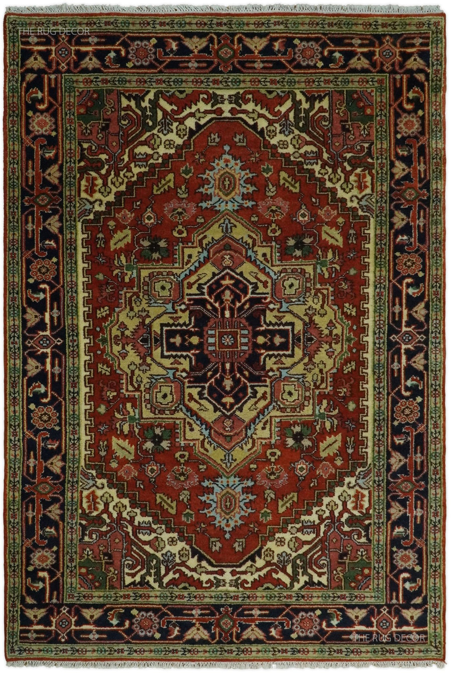 Traditional medallion rug with rust red center, dark blue border, and ornate geometric motifs