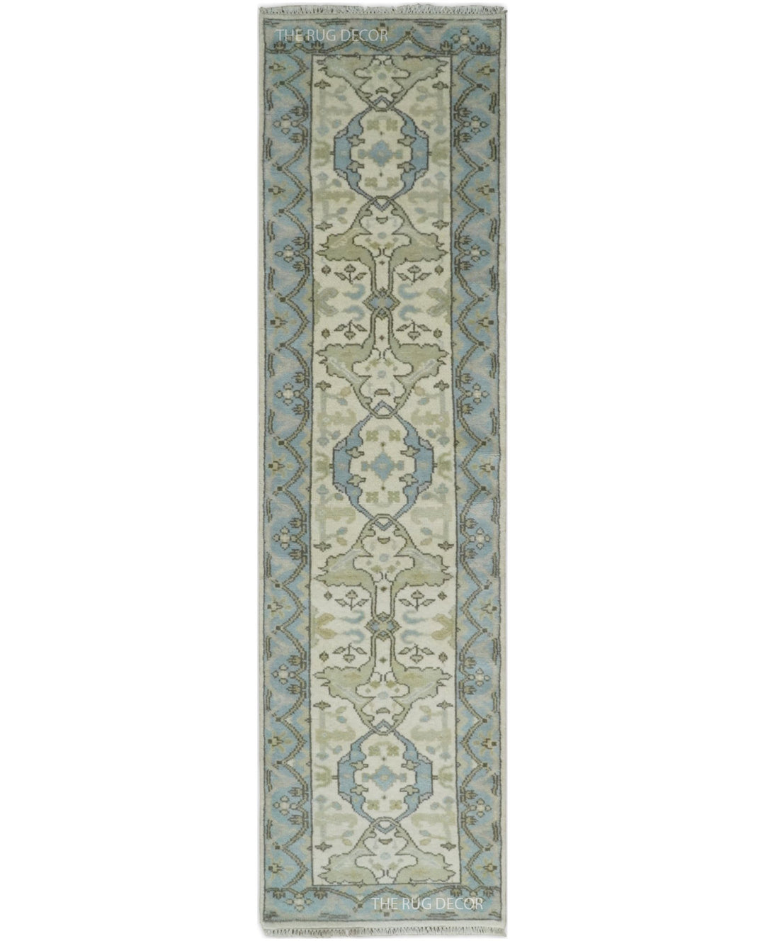 Ivory and blue hand-knotted wool runner rug with a central floral motif and patterned border