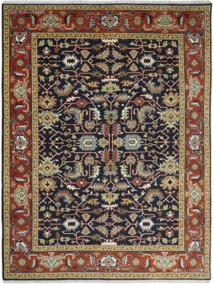 Traditional hand-knotted wool rug with a navy field and red ornamental border