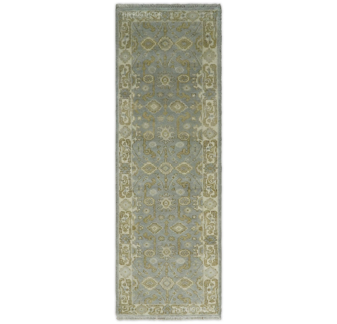 Gray and beige Oushak wool runner rug with ornate floral medallion pattern and border
