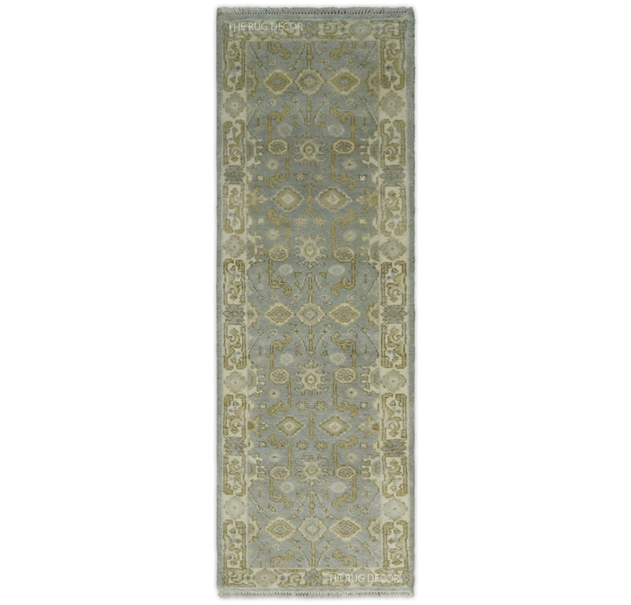 Gray and beige Oushak wool runner rug with ornate floral medallion pattern and border