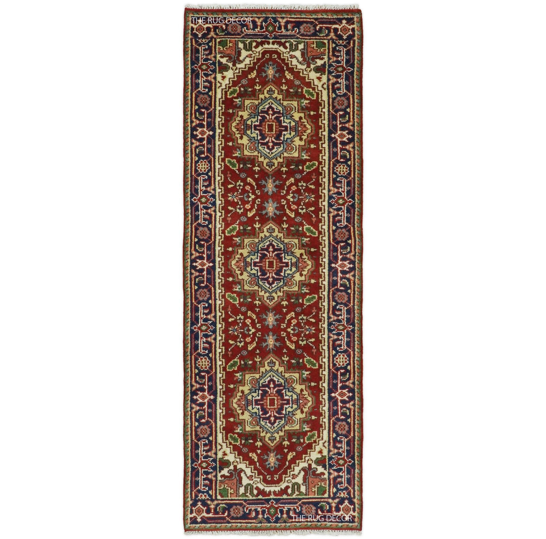 Traditional red and blue hand-knotted wool runner rug with three central medallions