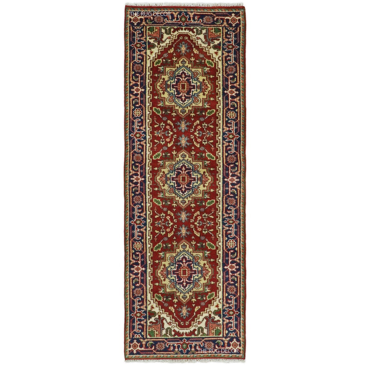 Traditional red and blue hand-knotted wool runner rug with three central medallions