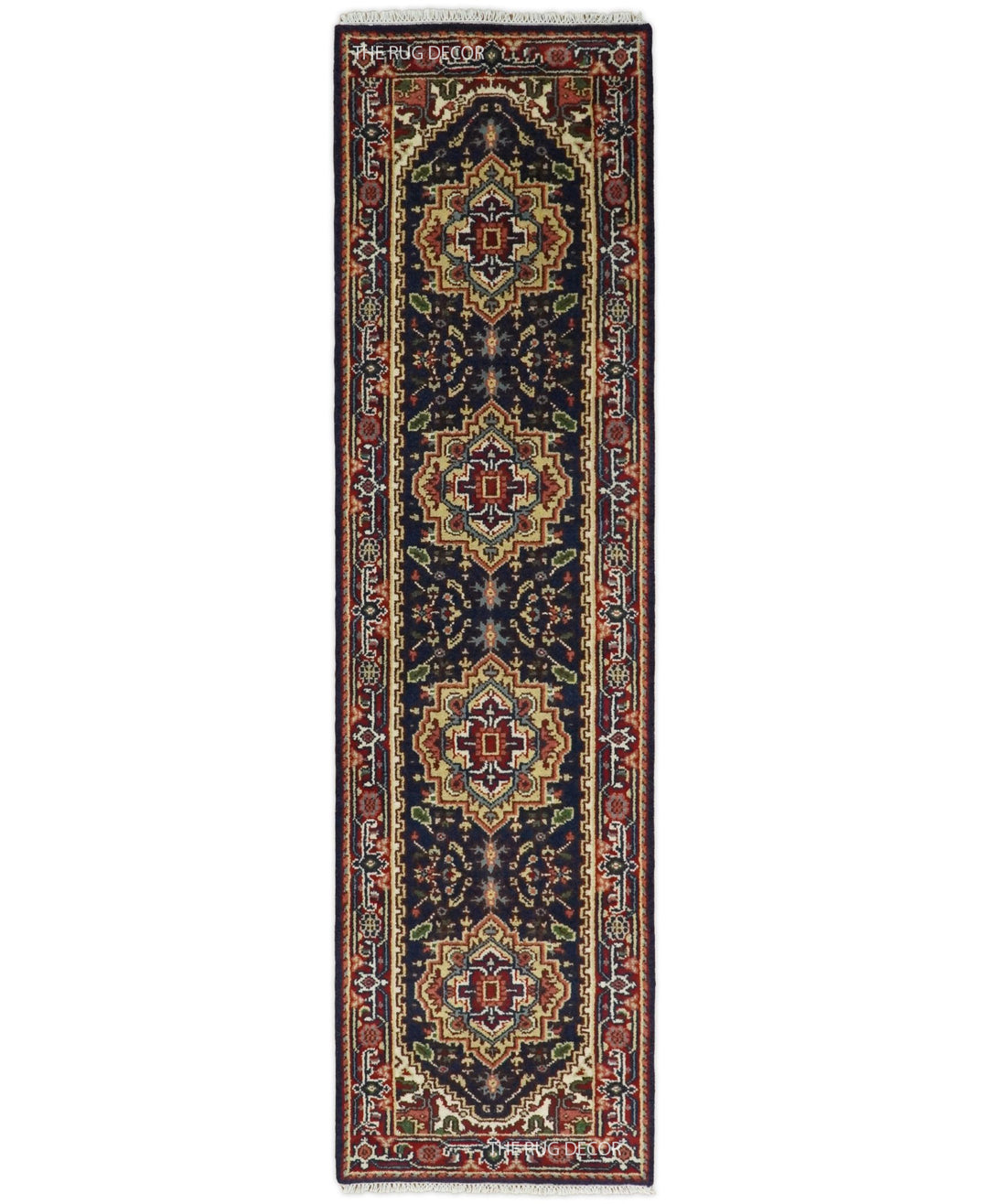 Traditional wool runner rug with red and dark blue geometric motifs and ornate borders