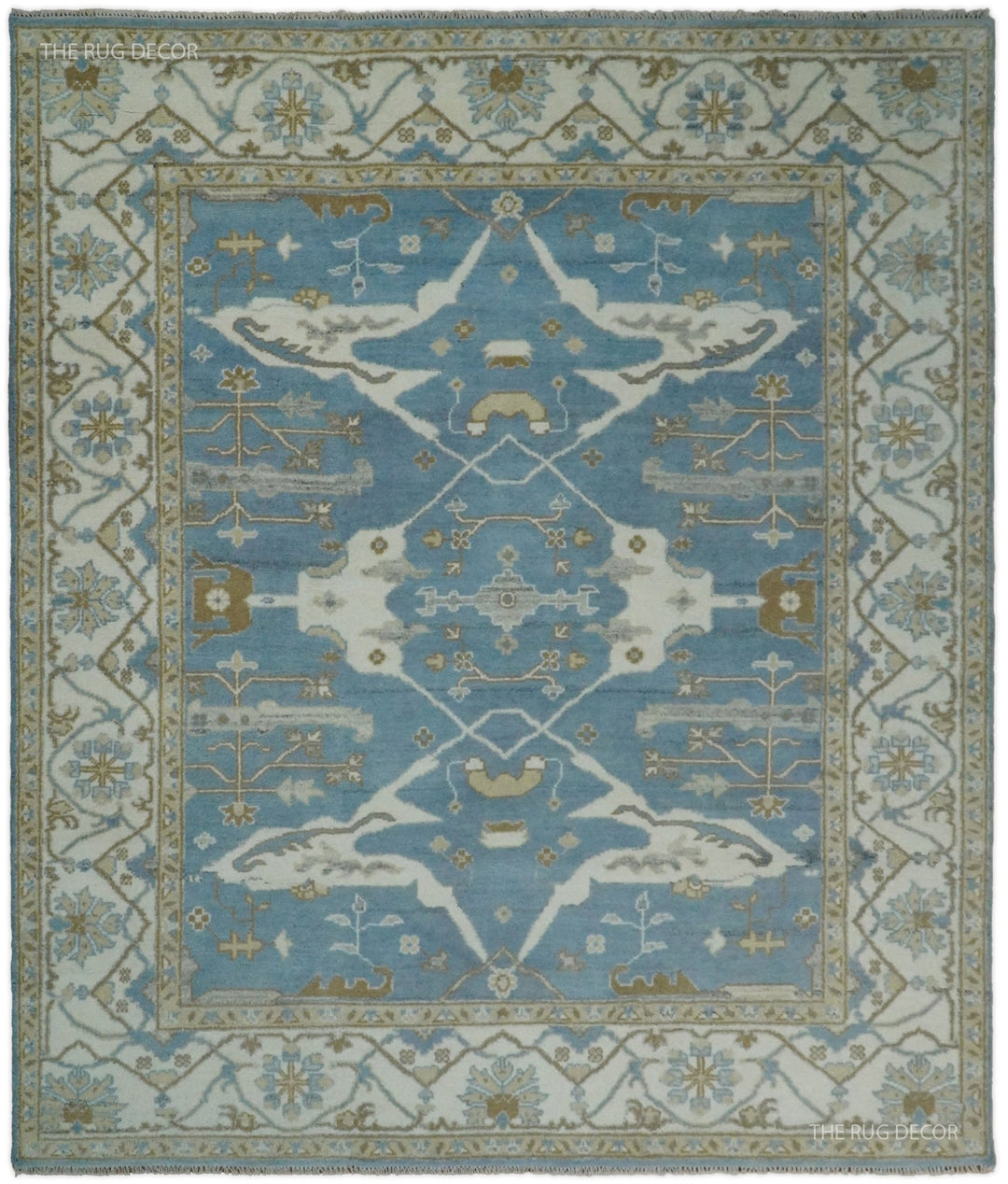 Blue and ivory hand-knotted wool Oushak rug with an ornate floral medallion and border