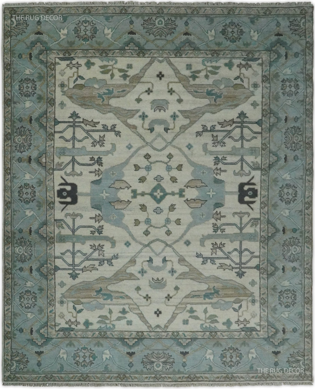 Blue and ivory hand-knotted wool Oushak rug with an ornate floral medallion and border