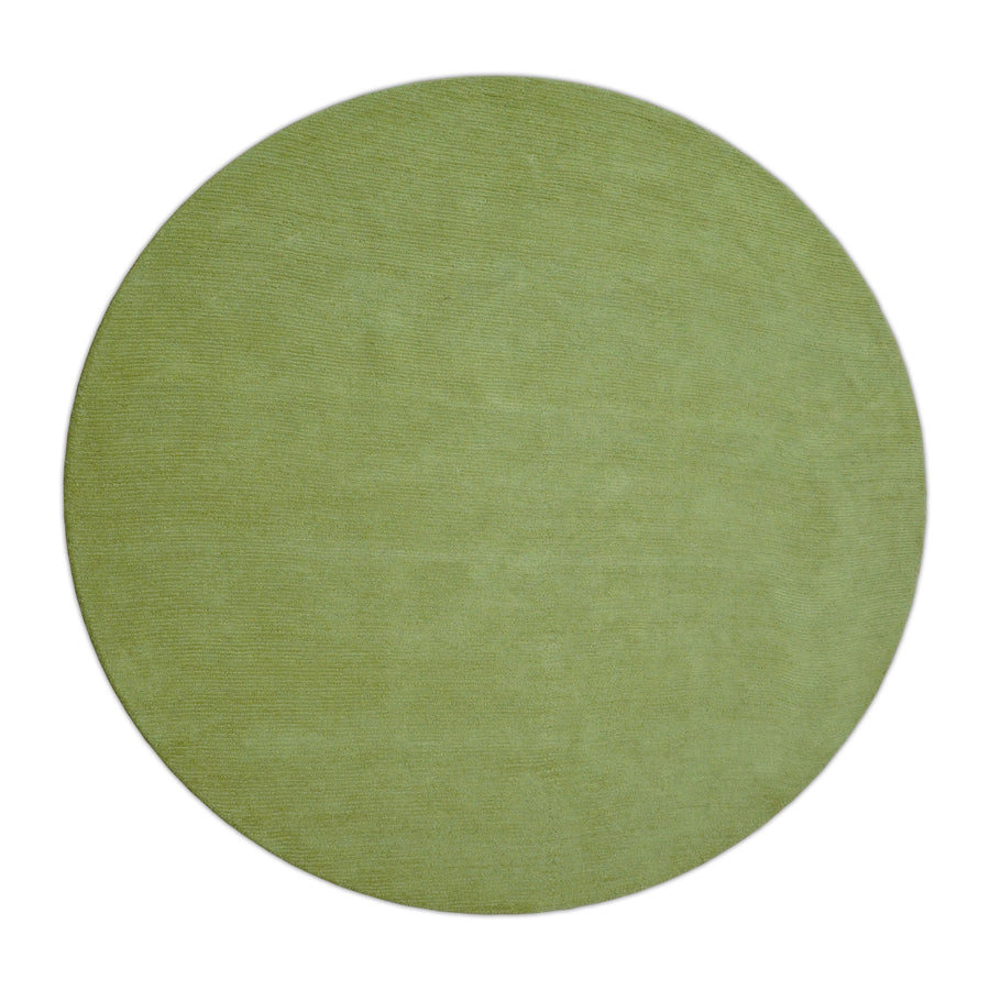 Round solid green hand-tufted wool rug, viewed from above