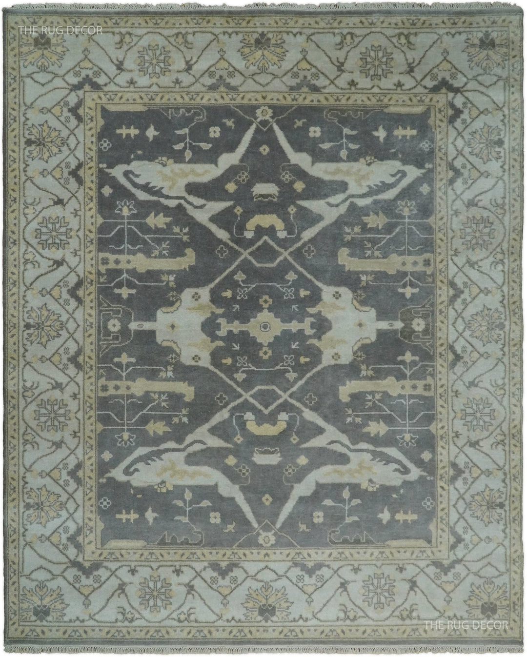 Vintage Oushak-style wool area rug with large gray center medallion in ivory