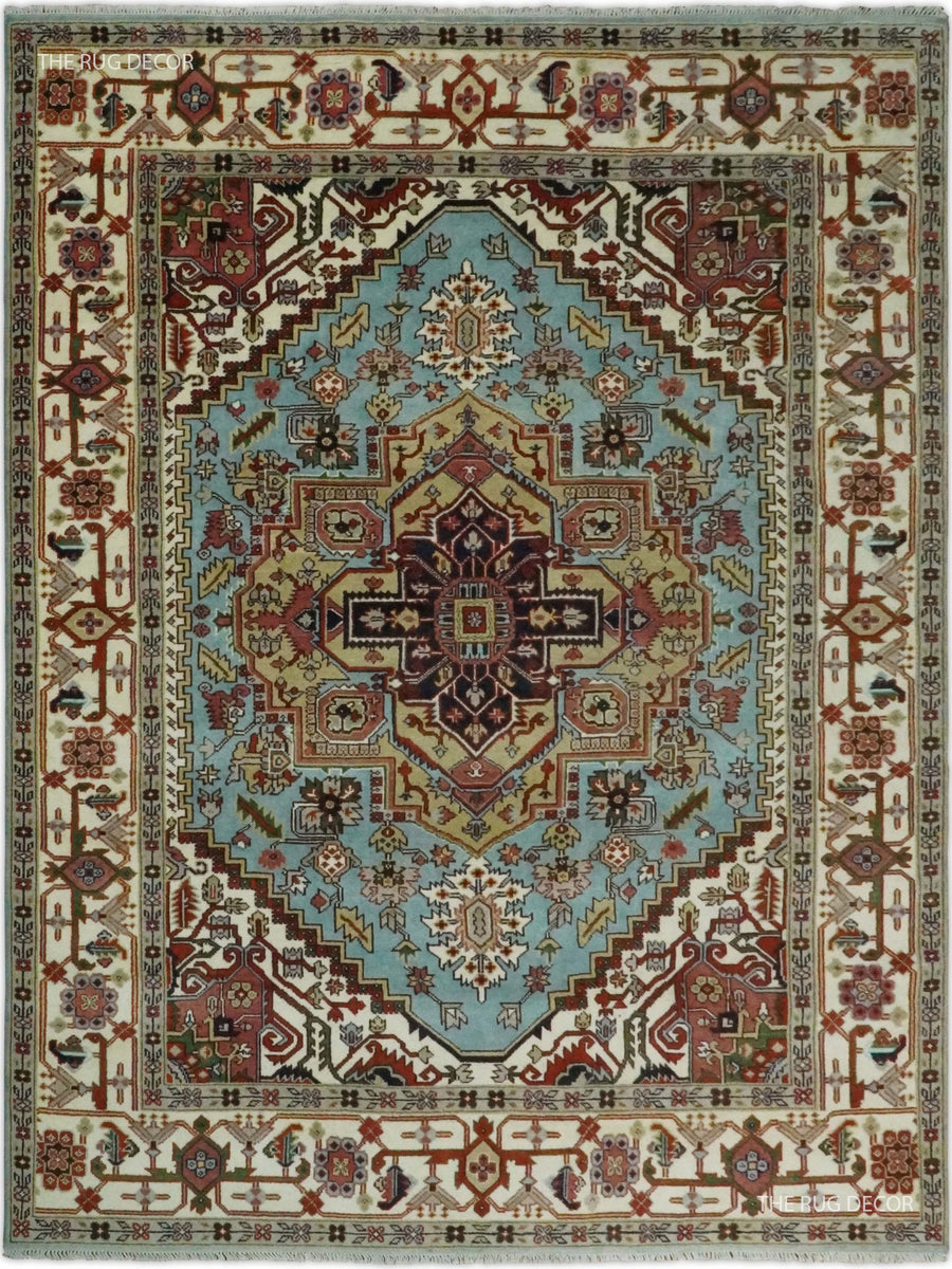 Traditional blue and ivory wool rug with an ornate central medallion and floral border