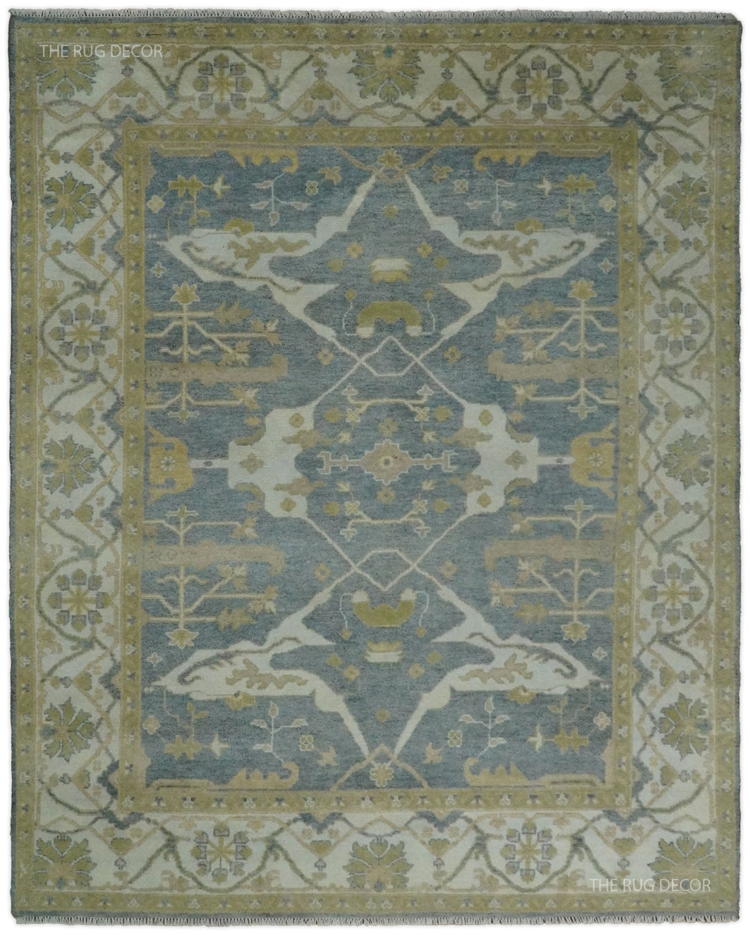 Gray and beige Oushak rug with a central floral medallion and ornate border