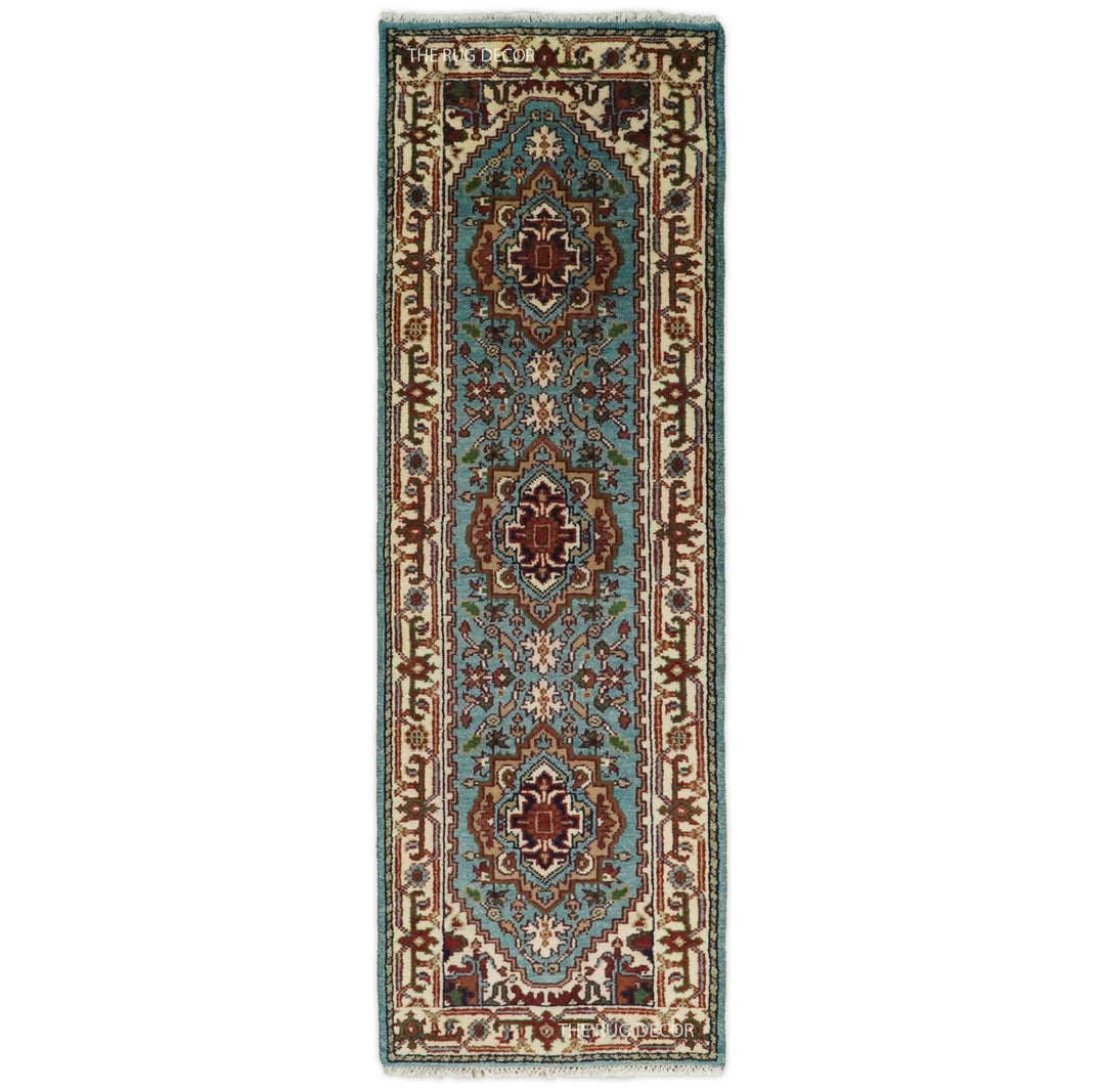 Blue and ivory hand-knotted wool runner rug with traditional floral medallions
