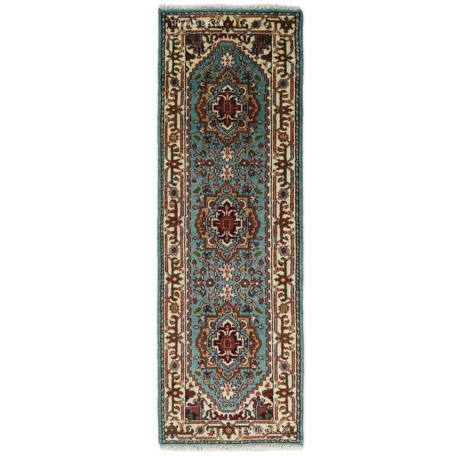 Blue and ivory hand-knotted wool runner rug with traditional floral medallions