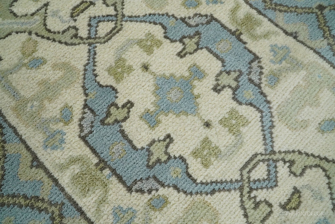 Close-up of the runner rug's dense wool pile and ivory, blue, and muted green pattern
