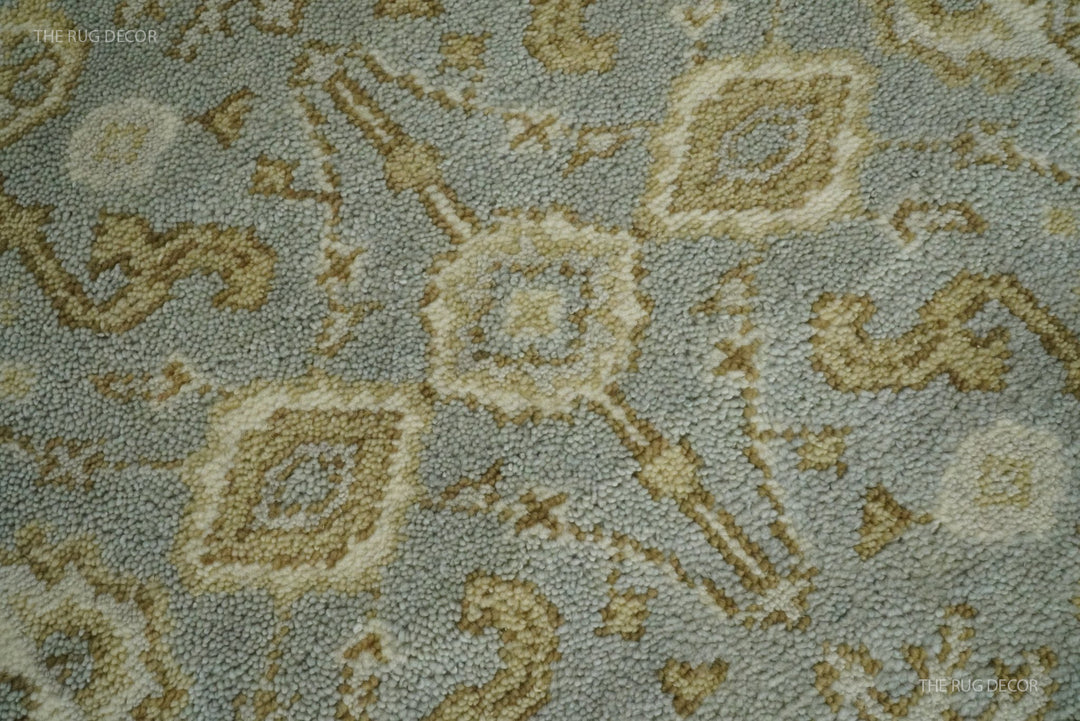 Close-up of the rug's textured wool pile and floral pattern