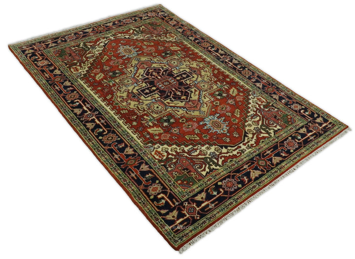 Corner view of traditional medallion rug in rust red, dark blue, and cream with patterned border