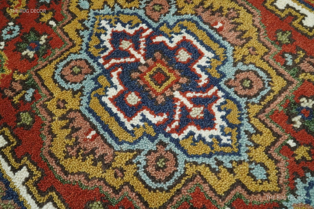 Close-up of the wool runner rug's textured multicolor floral medallion