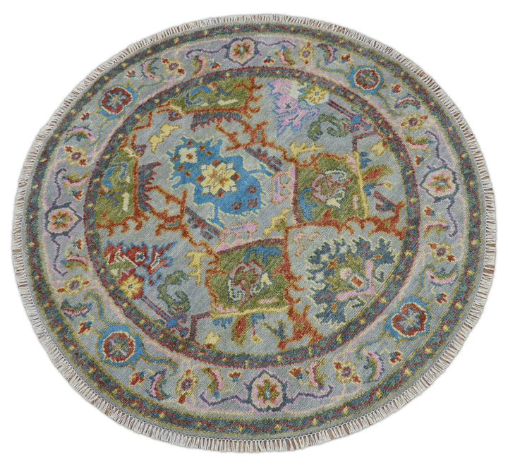 Round multicolor wool rug with central blue medallion and detailed corner motifs