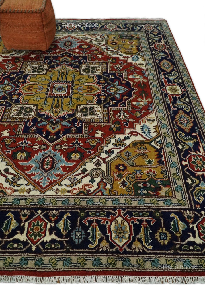 Rust and blue traditional Heriz Serapi area rug corner with fringe and ornate border