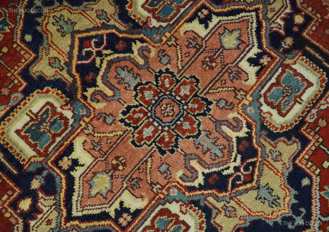 Close-up of red and blue traditional medallion pattern on hand-knotted wool rug