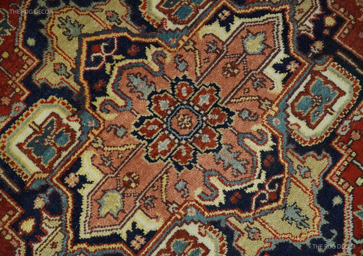 Close-up of red and blue traditional medallion pattern on hand-knotted wool rug