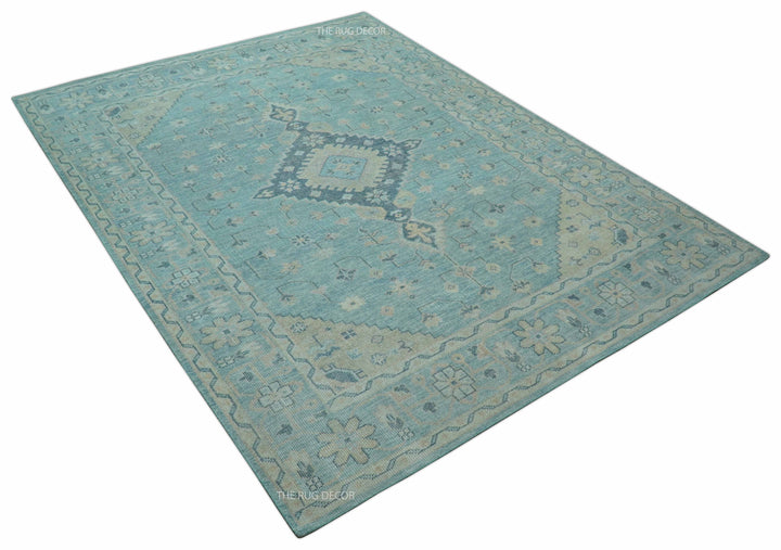 Hand-knotted wool area rug, blue with beige diamond motifs and border from corner view