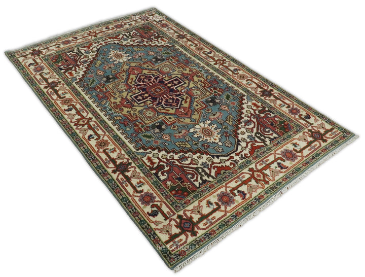 Angled view of a blue and ivory medallion rug with an intricate floral border