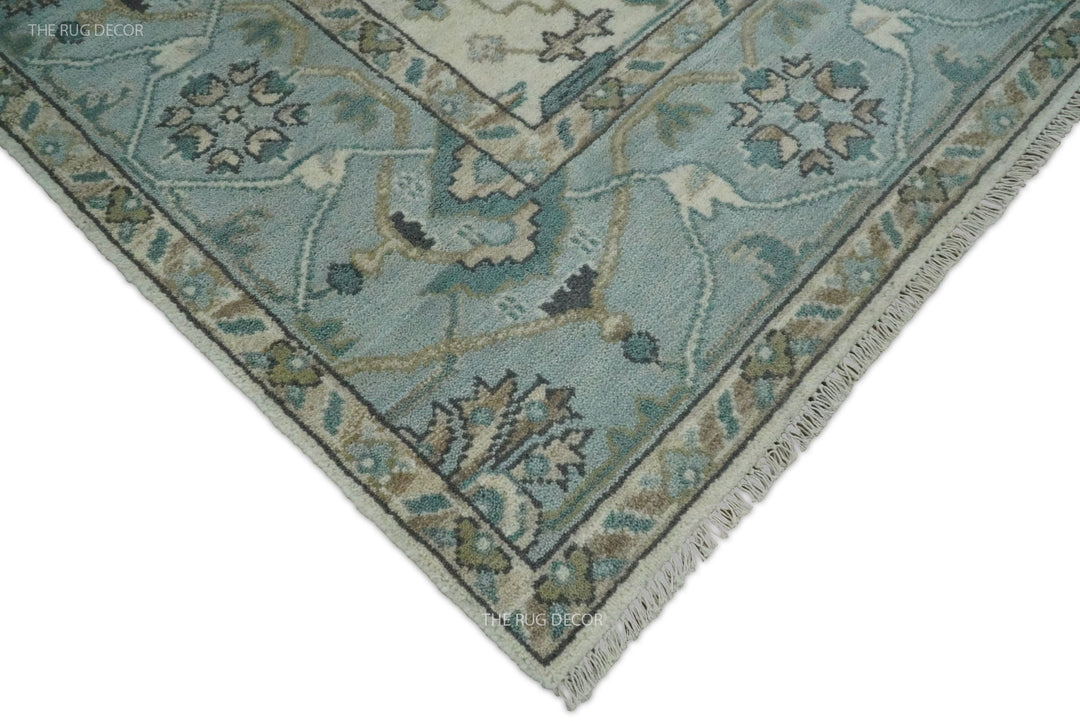 Oushak rug corner with floral border, bound edge, and short fringe