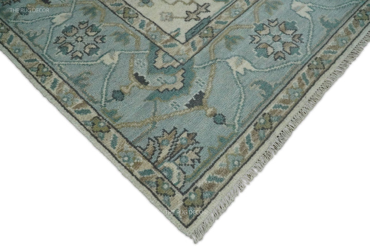Oushak rug corner with floral border, bound edge, and short fringe